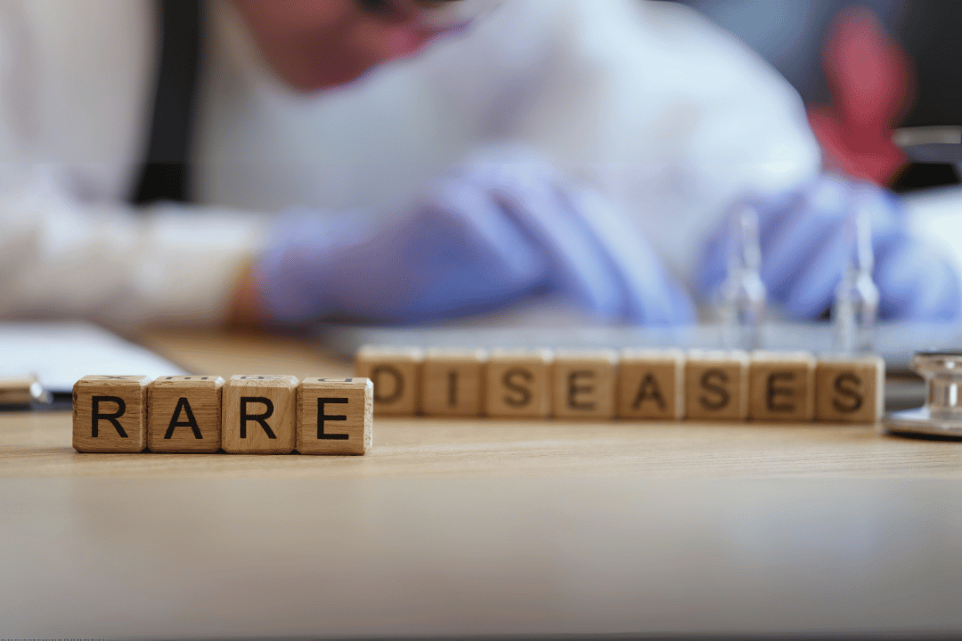 Medical researchers analyzing genetic data on a computer screen, representing the integration of next-generation phenotyping and genetic sequencing to diagnose ultrarare disorders.