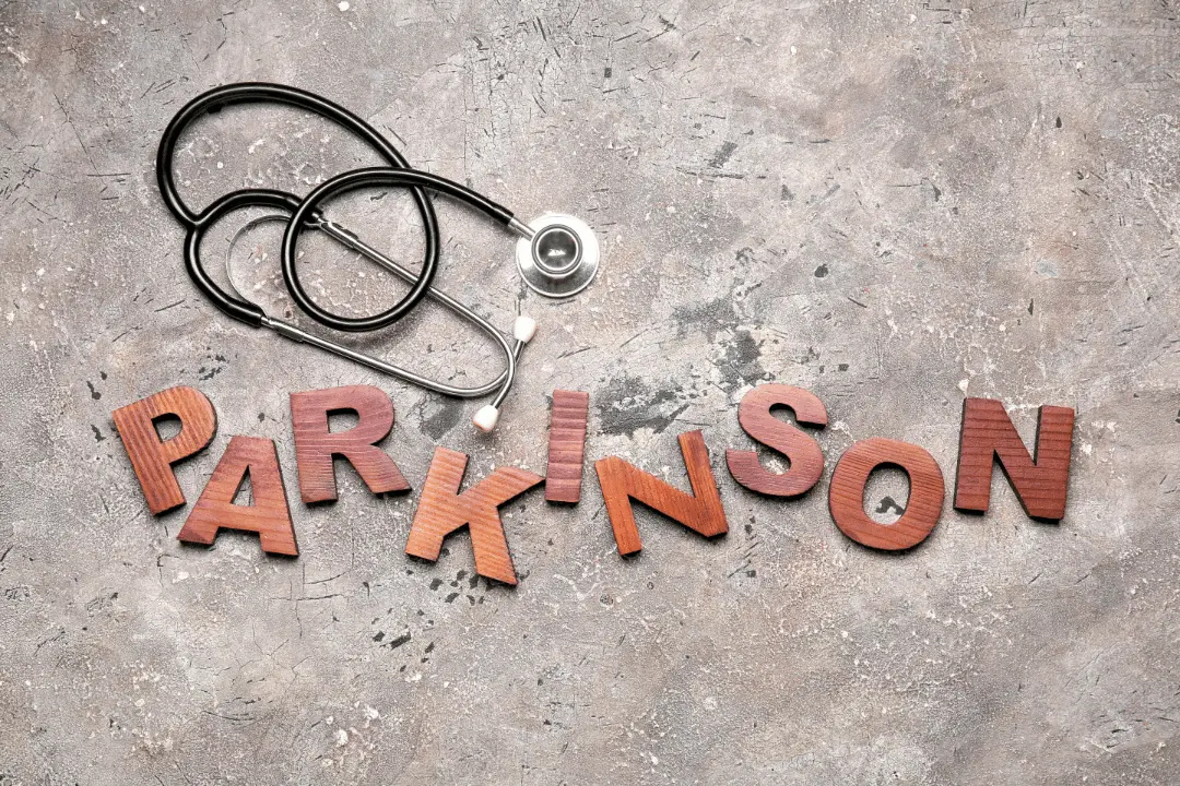 Word PARKINSON with Stethoscope on Grunge Background